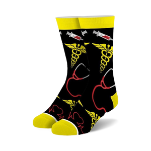 Pair of crew socks in black with yellow and red medical symbols: caduceus, stethoscope, and EKG line.  Fun and quirky design.