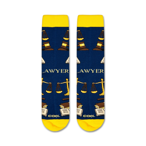 Flatlay showcasing the Lawyer socks, highlighting their navy blue color and gold design details.
