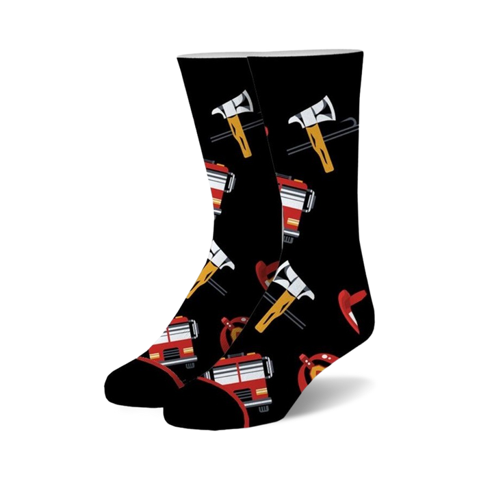 Pair of black crew socks featuring red fire trucks, axes, and helmets. Fun and playful design.