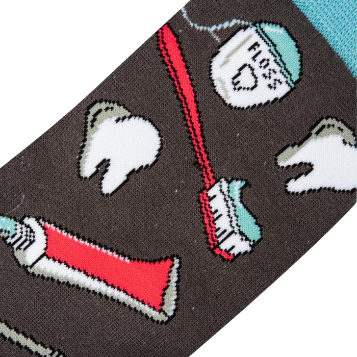 Close-up detail shot of the sock fabric, showing the crisp and detailed print of the dental tools and teeth.