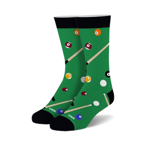 Pair of crew socks with a green pool table design. Features billiard balls in various colors and cues. Black cuff.