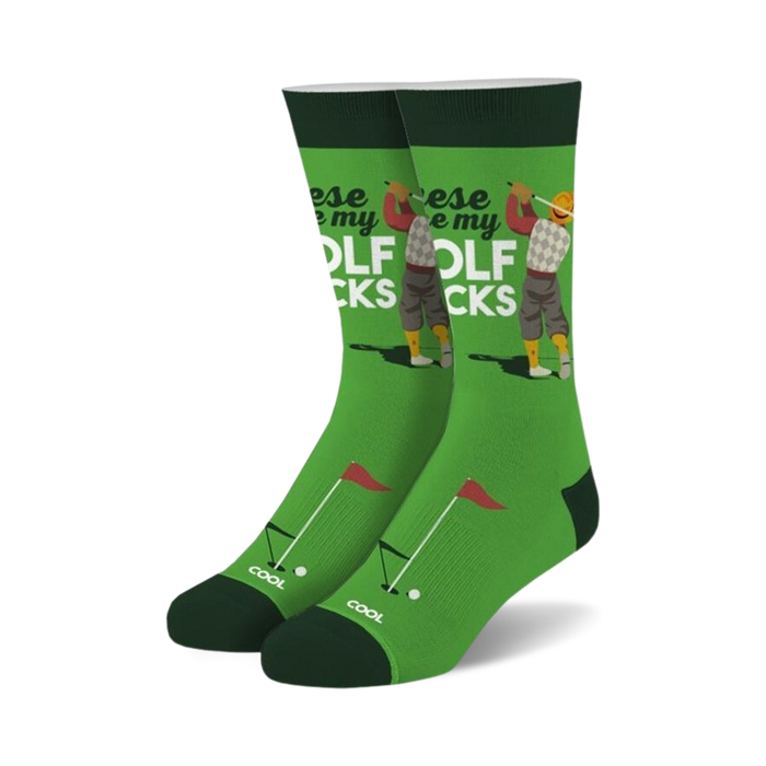 Pair of green crew socks with a retro golfer graphic, red and white text that says 'These are my golf socks', and small golf flag and ball details.
