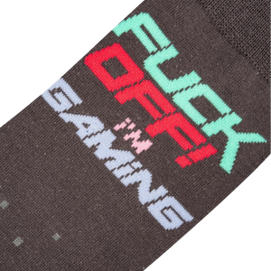 Close-up detail shot of the sock's 'Fuck Off I'm Gaming' text and pixelated design.