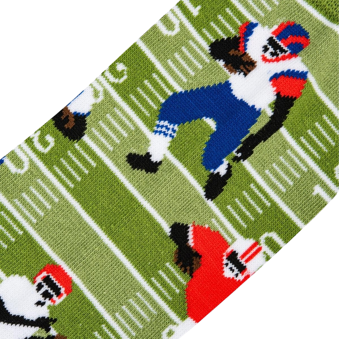 Close-up detail shot showing the fun, illustrated football player design on the socks.