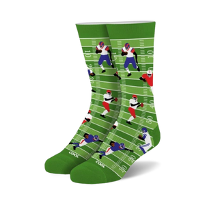 Crew socks in green, white, blue, and red. Design features cartoon football players on a field.
