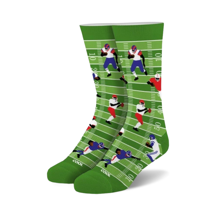 Crew socks in green, white, blue, and red. Design features cartoon football players on a field.