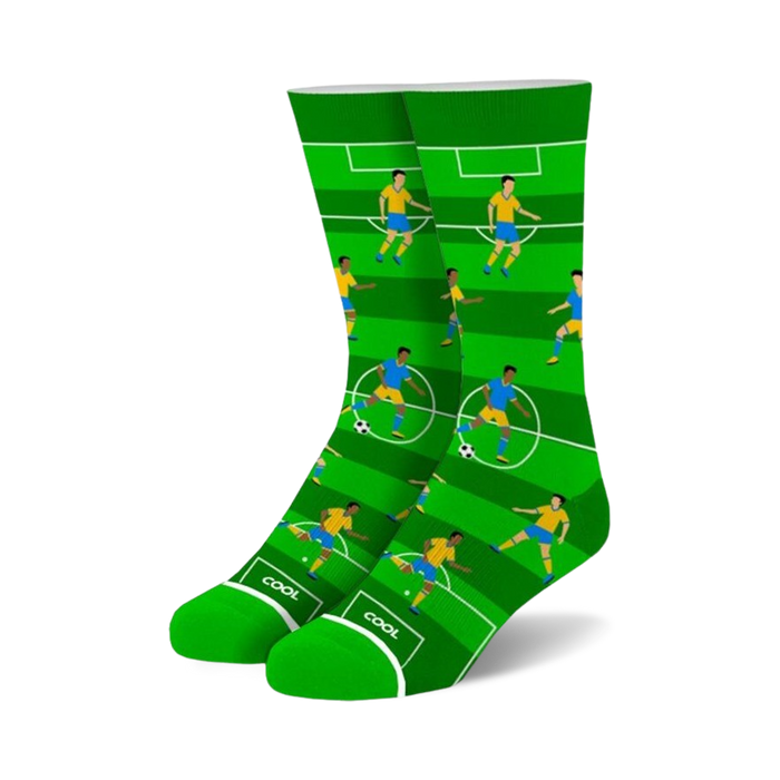 Crew socks in green and blue featuring a soccer field design with cartoon players.