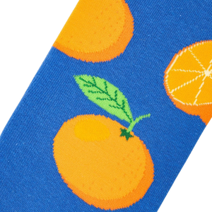 Close-up detail shot of the Oranges sock fabric, showcasing the orange and blue design.