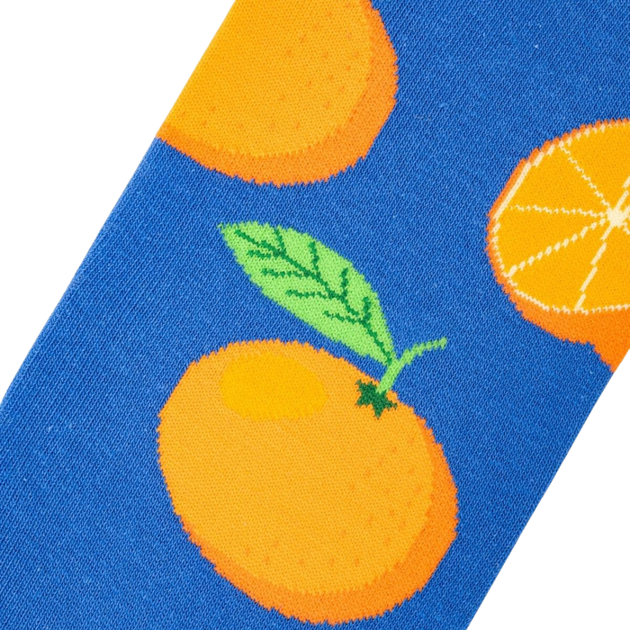 Close-up detail shot of the Oranges sock fabric, showcasing the orange and blue design.