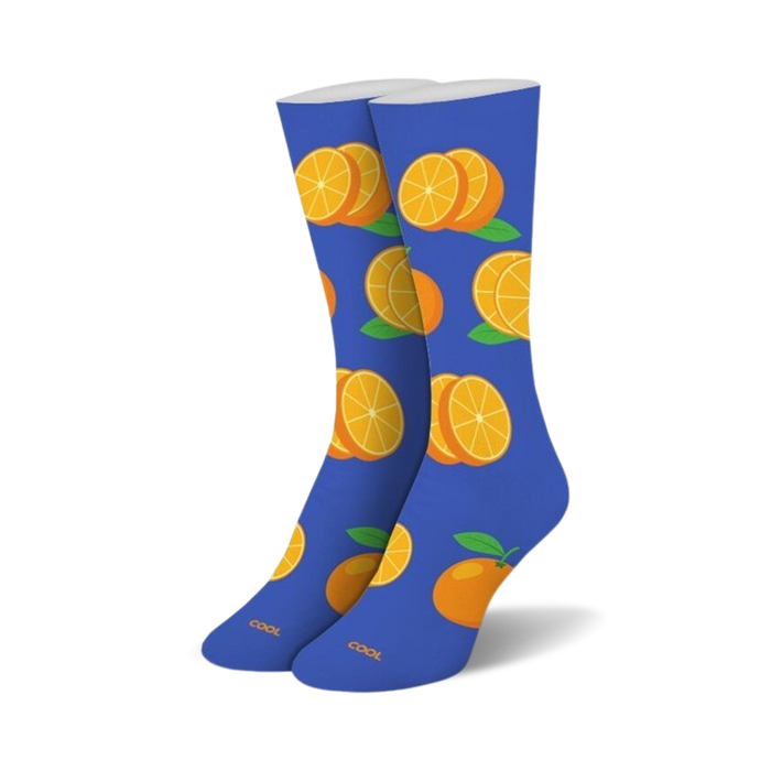 Pair of crew socks; blue background with orange slices and whole oranges.  Fun, casual style.
