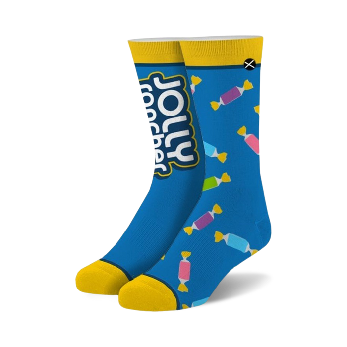 Crew socks in blue with yellow cuffs. The design features Jolly Rancher candy wrappers in assorted colors. }}