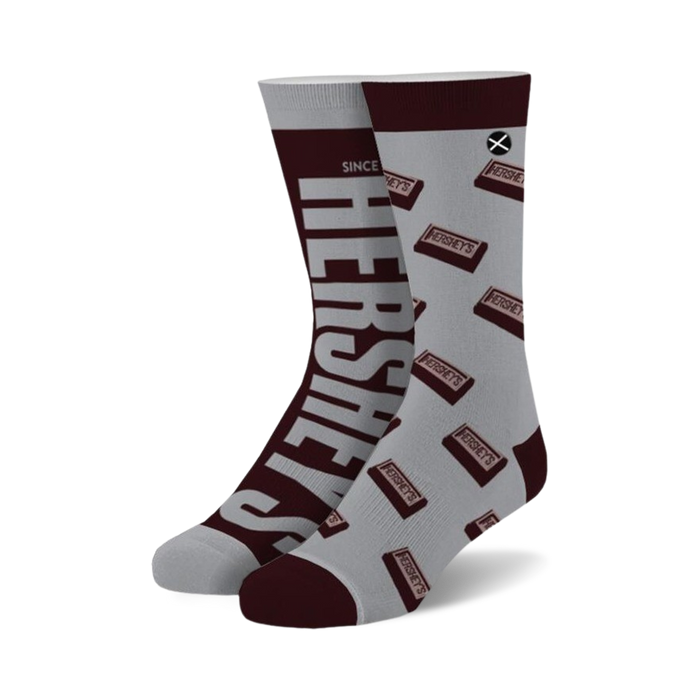 Pair of crew socks; grey background with brown Hershey's chocolate bar pattern and large Hershey's logo on the side. }}