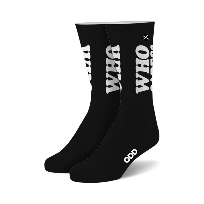 Pair of black crew socks with a large white 'WHO CARES?' graphic. Small 'ODD' logo on the sole. }}