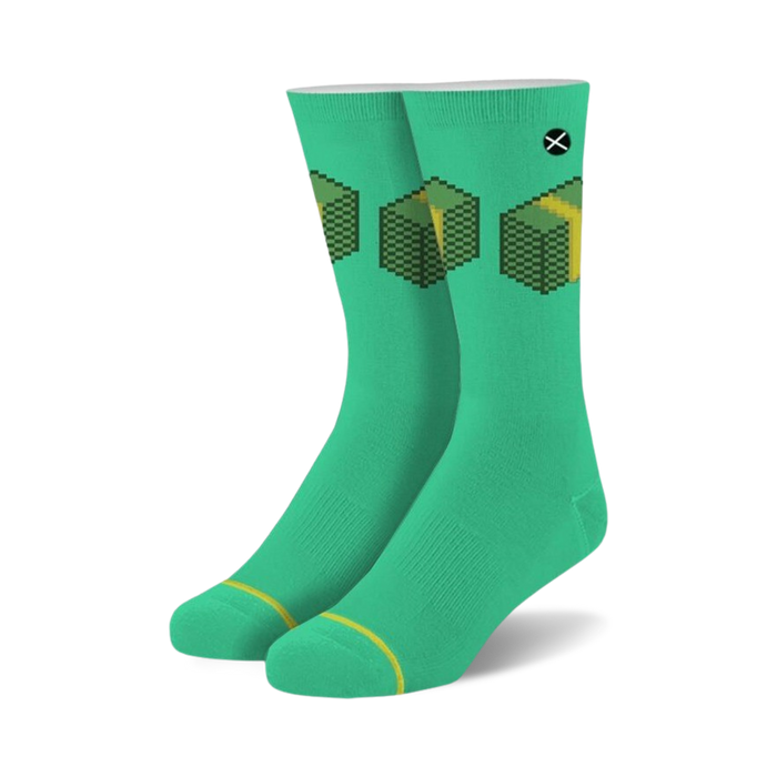 Pair of teal crew socks with a pixelated image of stacks of money. The design is in yellow and green. }}