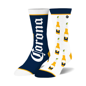 Crew socks in navy and white, featuring a Corona logo on one sock and a repeated pattern of Corona beer bottles with limes on the other.