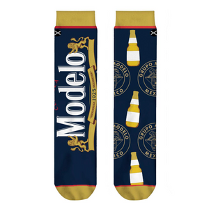 Close-up shot of Modelo Split socks, highlighting the detailed Modelo logo and bottle design.