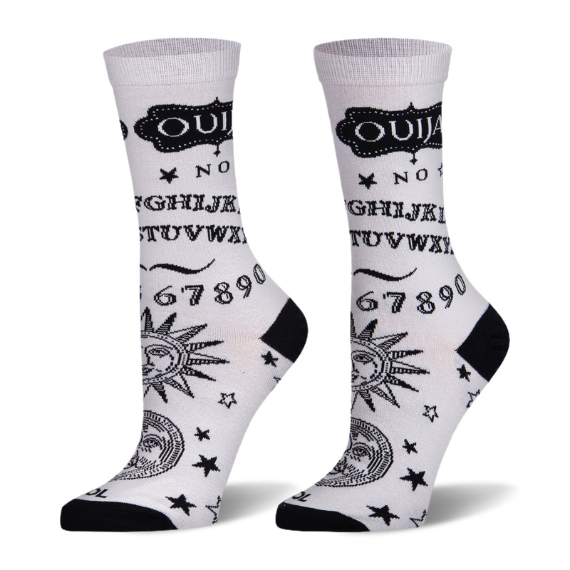 White socks with black Ouija board design showing letters, numbers, stars, and celestial faces. Black heel and toe.