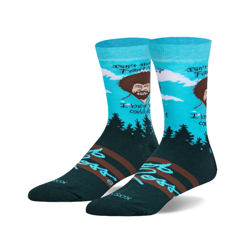 Crew socks in teal, dark green, and brown. Feature Bob Ross's portrait, his quote, and a pine forest scene.