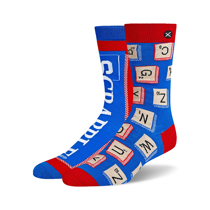 Pair of blue and red crew socks. One sock features Scrabble tiles, the other the Scrabble logo. Fun and geeky!