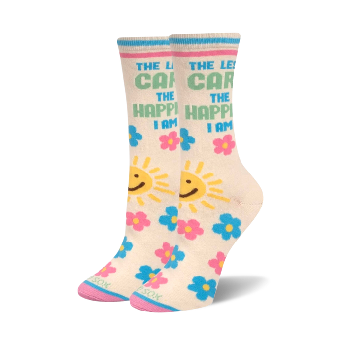 Cream-colored crew socks with 'The Less I Care, The Happier I Am' text, suns, and pink and blue flowers. }}