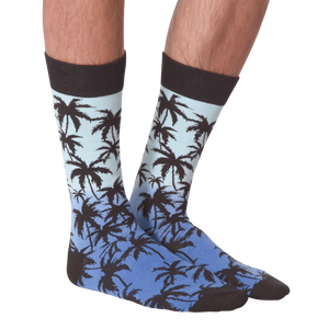 Front view of Palm Socks on a person's legs against a black background.