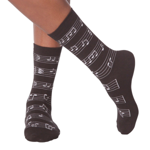 Flat lay image of a pair of white musical note socks.