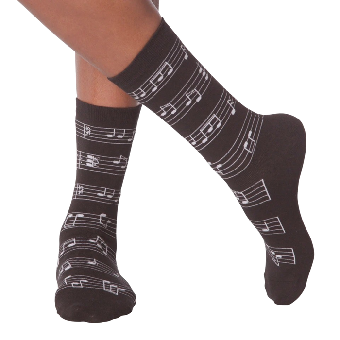 Flat lay image of a pair of white musical note socks.