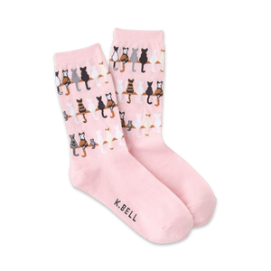 A pair of pink crew socks with the same cat pattern as the grey socks, shown against a white background.