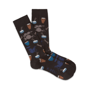 Pair of dark brown crew socks with a pattern of illustrated drums, drumsticks, and cymbals in blue and brown.