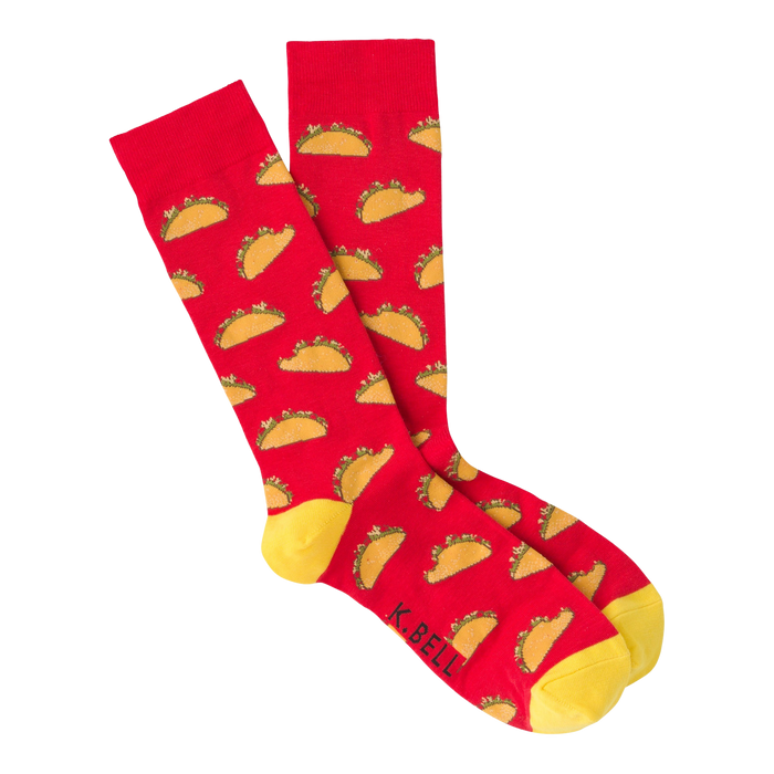 red crew socks featuring a pattern of tacos with lettuce, tomatoes, and cheese on a yellow background, perfect for the taco enthusiast in your life.  
