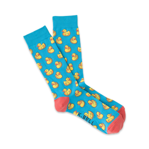 Pair of light blue crew socks with a repeating pattern of yellow rubber ducks.  Coral-colored heel and toe.