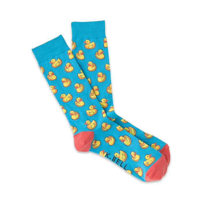 Pair of light blue crew socks with a repeating pattern of yellow rubber ducks.  Coral-colored heel and toe.