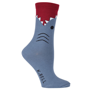 A pair of gray socks with a shark design. The shark has a red fin and black eyes.