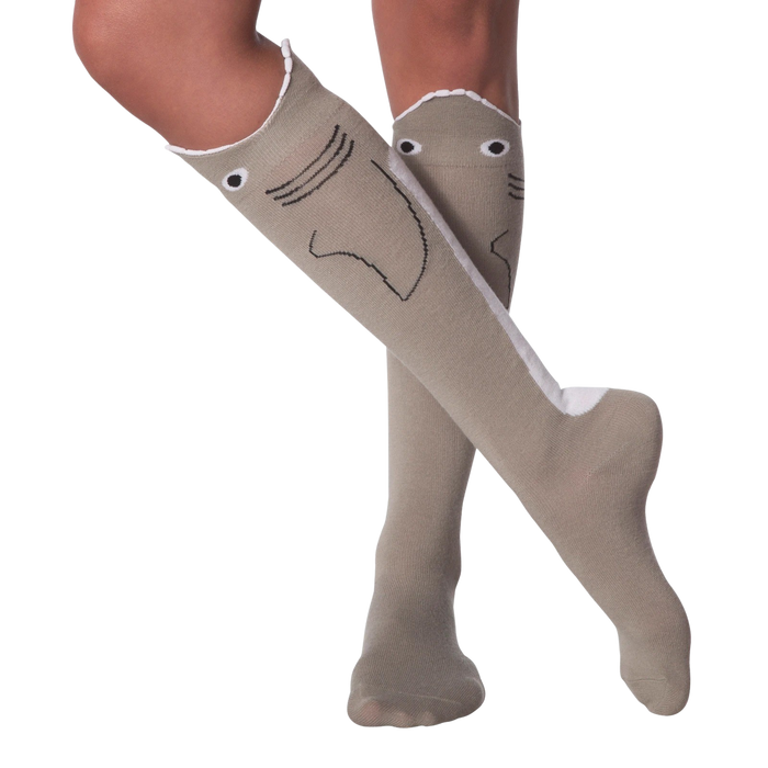 Lifestyle shot: Model's legs showing off the knee-high shark socks with legs crossed.