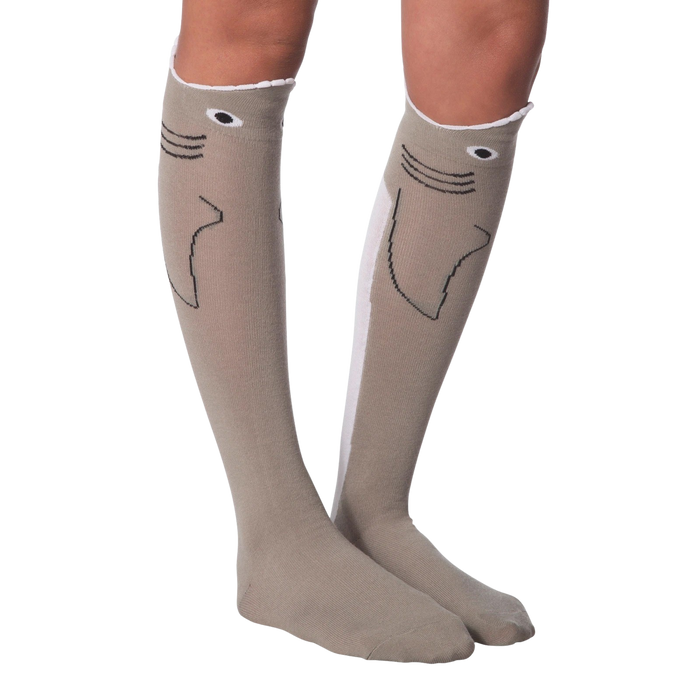 Lifestyle shot: Model's legs crossed, wearing the shark socks. Socks are front and center.