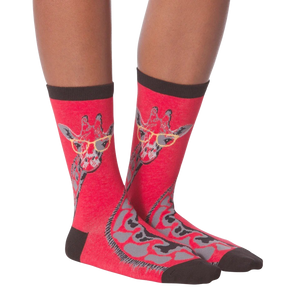 A pair of red socks with a giraffe wearing yellow eyeglasses on each sock.