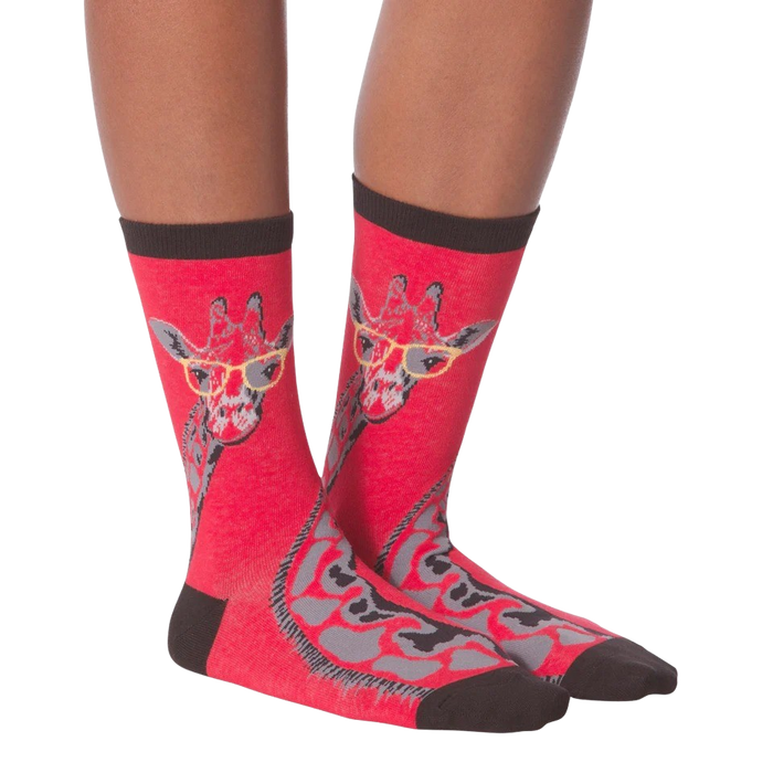 A pair of red socks with a giraffe wearing yellow eyeglasses on each sock.