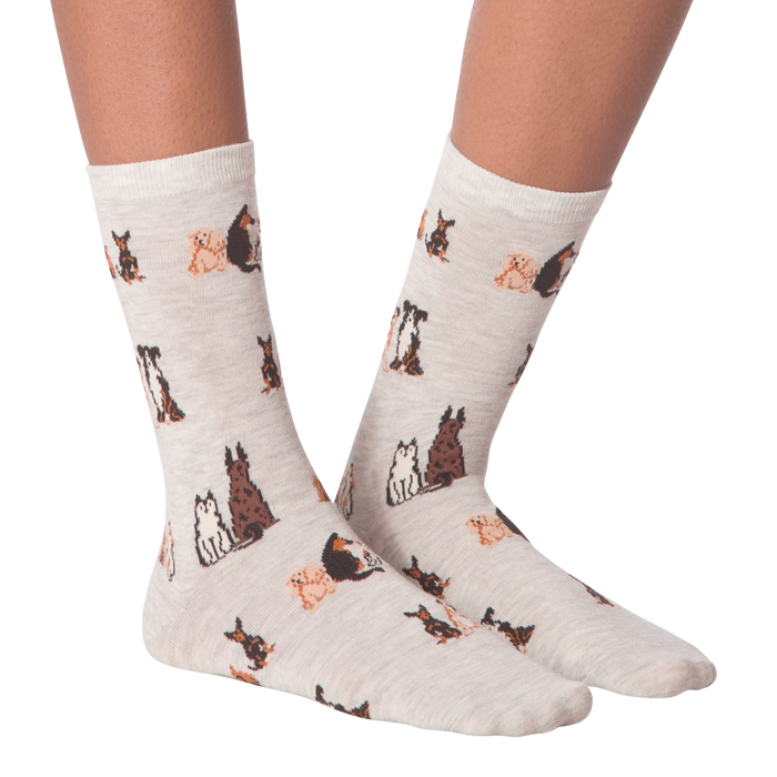 Close-up studio shot of a pair of the grey crew socks; showcasing the dog pattern.