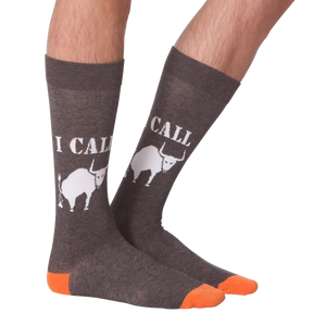 Lifestyle shot of a person's legs wearing the 'I Call Bullshit' socks, showing the fit and style.