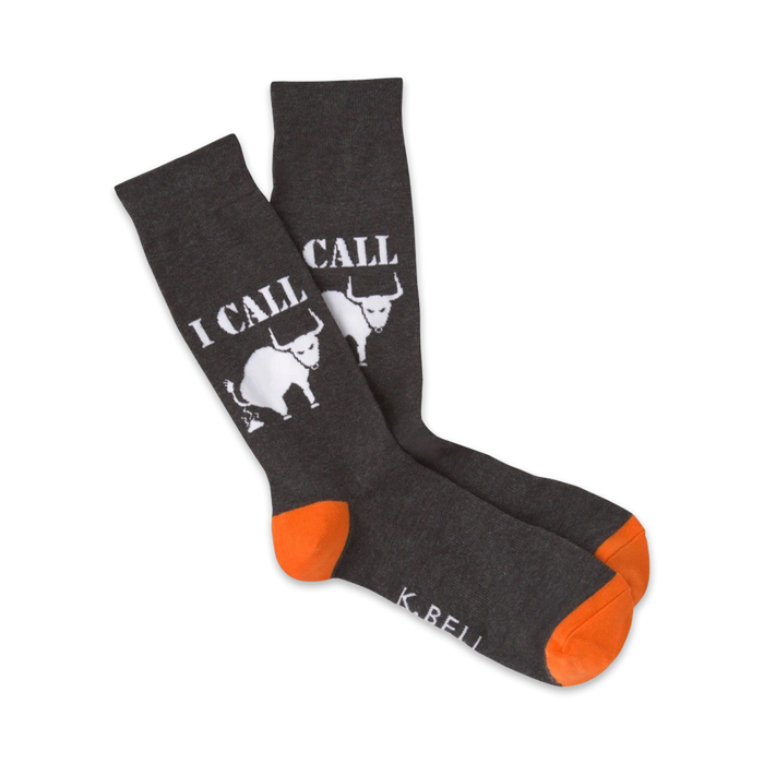 Pair of gray crew socks with an orange cuff, featuring a white 'I Call Bullshit' design with a pooping bull graphic.