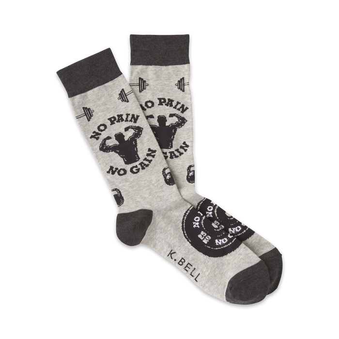 A pair of grey crew socks with a black and white design. The socks feature weightlifting imagery, barbells, and the text 'No Pain No Gain'. }}