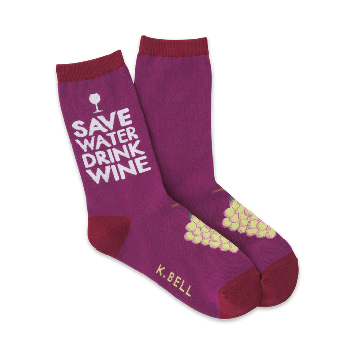 crew length purple socks for women with 'save water drink wine' text on the leg, grape graphic on the foot, and k. bell brand name on the sole.   }}