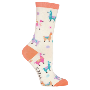 Side view of a single cream crew sock with coral pink cuff and pastel llama design on a black background.