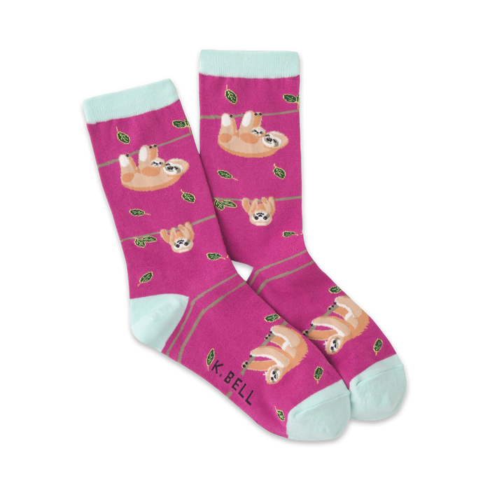 pink crew socks with a pattern of sloths hanging from green branches with dark green leaves. fun and funky socks for women.   }}