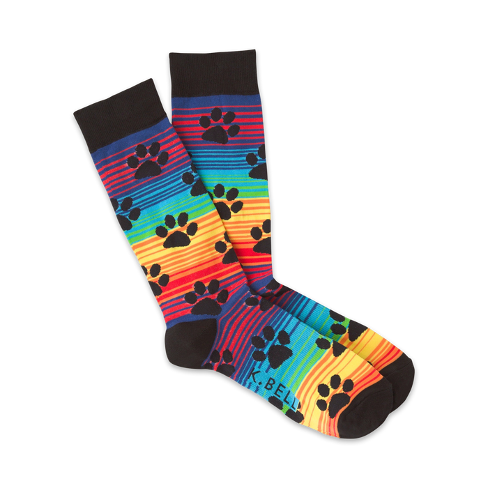 Pair of crew socks with rainbow stripes and black paw prints.  Features black cuffs and a subtle logo. }}