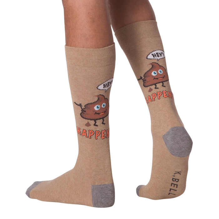 A pair of brown calf-length socks with a cartoon poop emoji on each sock. The poop emoji has a smiling face and is saying 