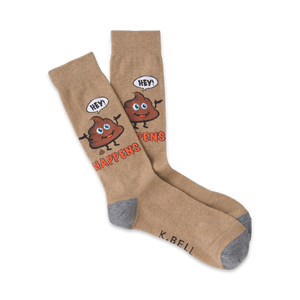 Tan crew socks with a whimsical brown poop emoji design. The emoji says 'Hey!' and the socks read 'Shit Happens'.