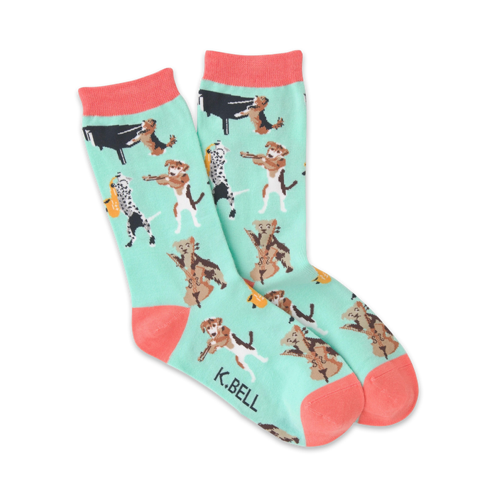 Crew socks in mint green with coral cuffs.  The design features various breeds of dogs playing musical instruments like the piano, cello, and saxophone.