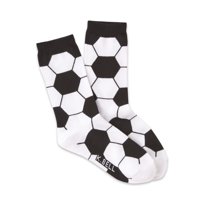 black and white crew socks with a pattern of black pentagons with white centers representing soccer balls.  }}