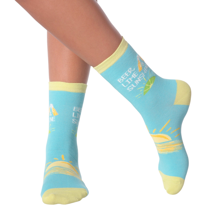 Close-up of a model's legs wearing the Beer Lime Sunshine socks.  Shows the socks on feet.